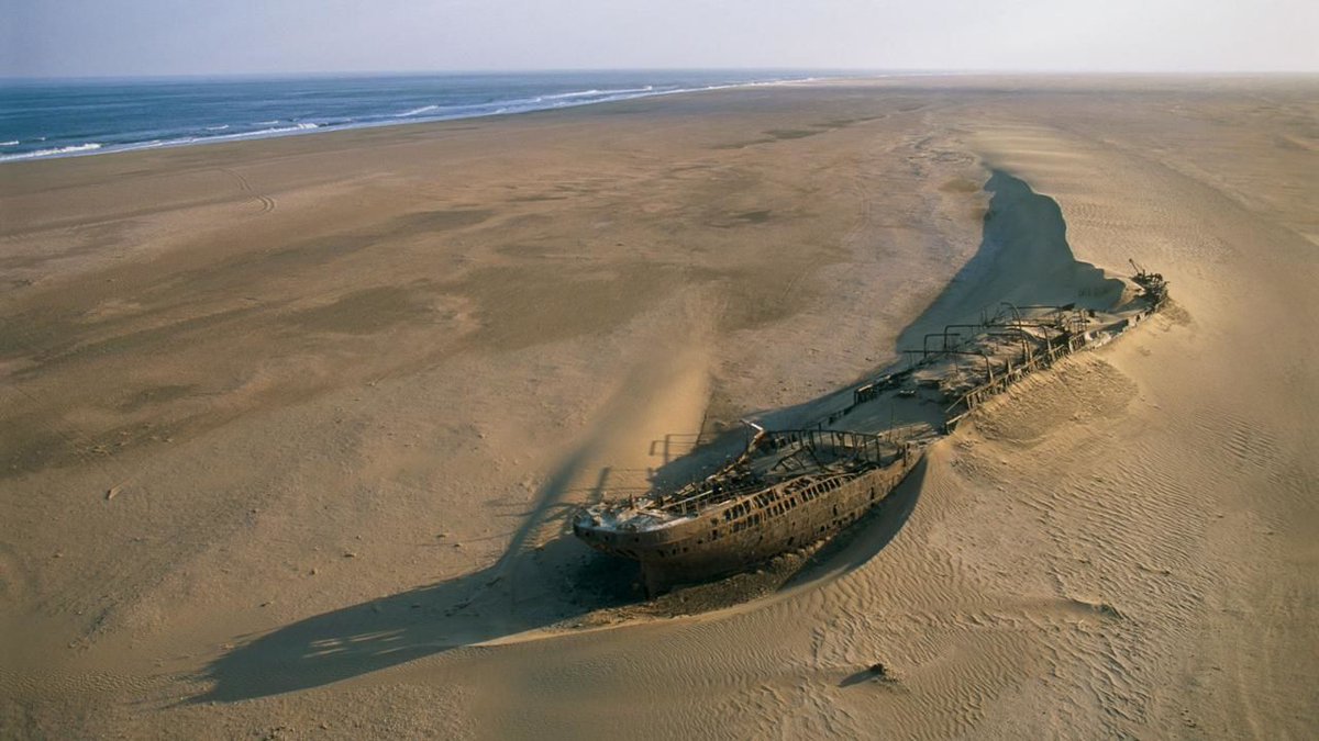 Eduard Bohlen shipwreck, partially buried in sand